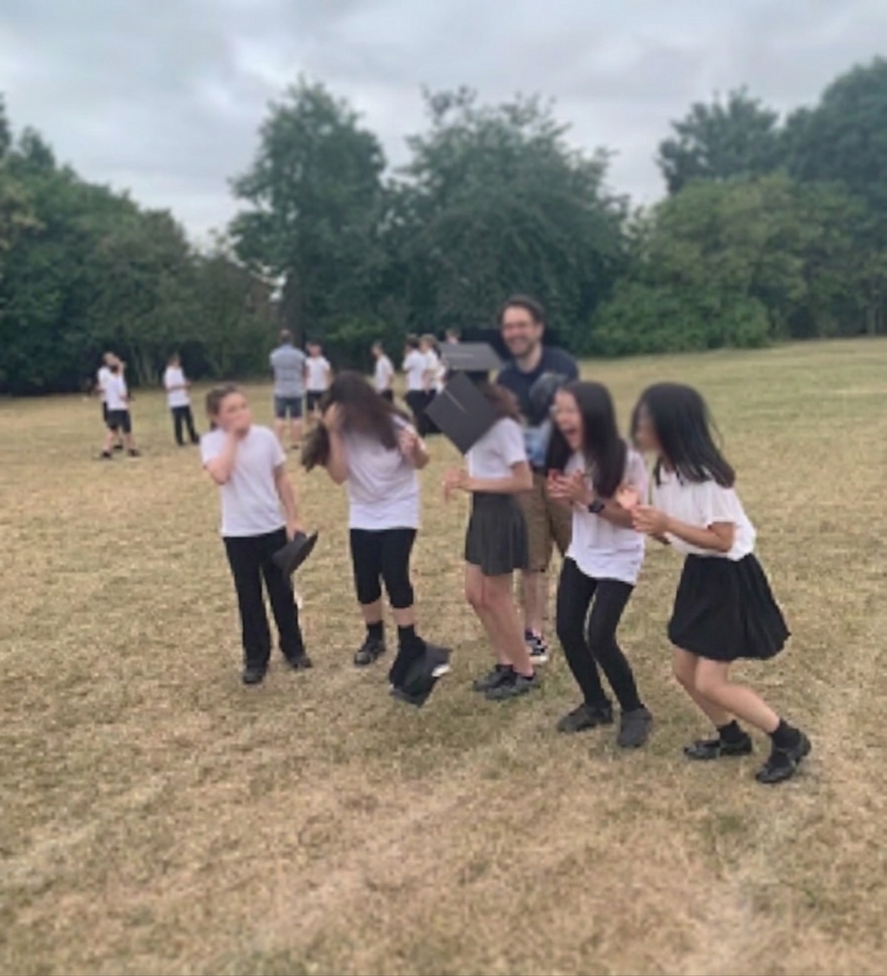 Macy and classmates outdoors